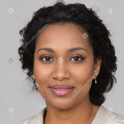 Joyful black young-adult female with long  black hair and brown eyes