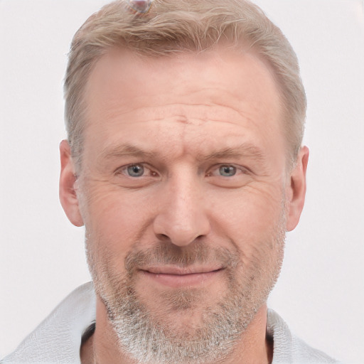 Joyful white adult male with short  brown hair and grey eyes