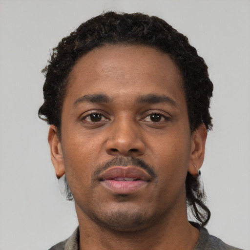 Neutral black young-adult male with short  black hair and brown eyes