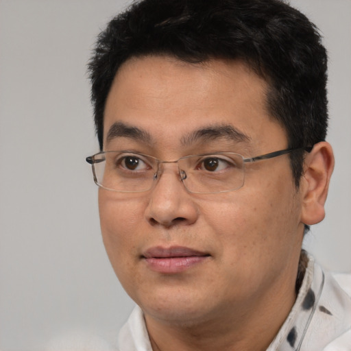 Neutral asian adult male with short  brown hair and brown eyes