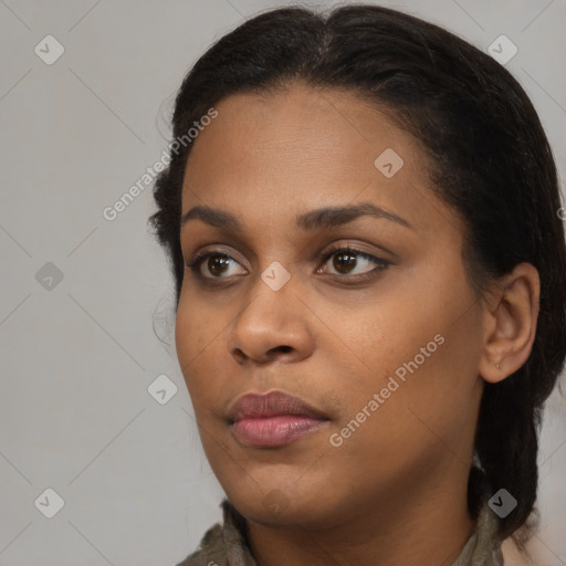 Neutral black young-adult female with medium  brown hair and brown eyes