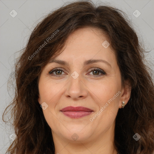 Joyful white adult female with long  brown hair and brown eyes