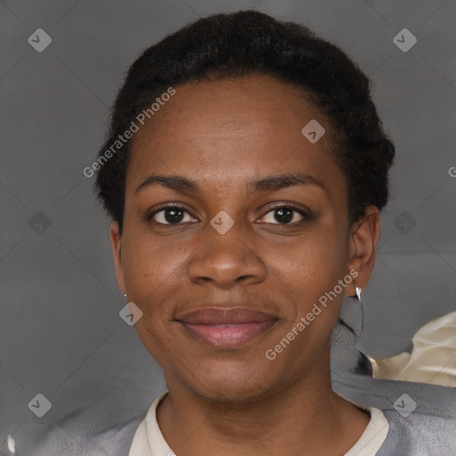 Joyful black adult female with short  brown hair and brown eyes