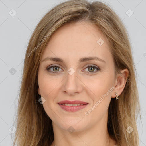 Joyful white young-adult female with long  brown hair and green eyes