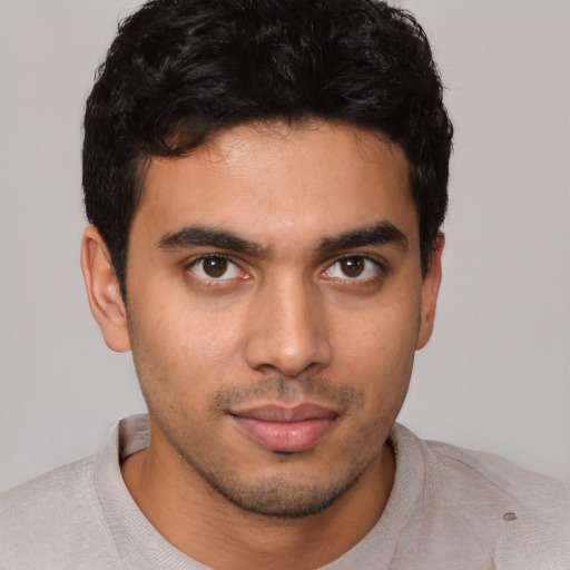 Neutral latino young-adult male with short  brown hair and brown eyes