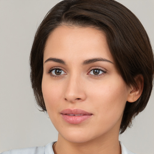 Neutral white young-adult female with medium  brown hair and brown eyes