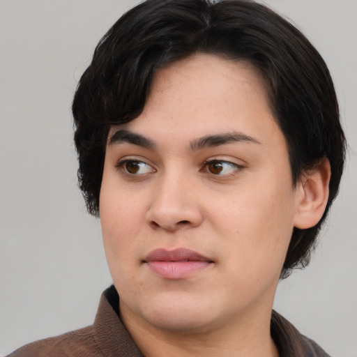 Joyful white young-adult female with medium  black hair and brown eyes