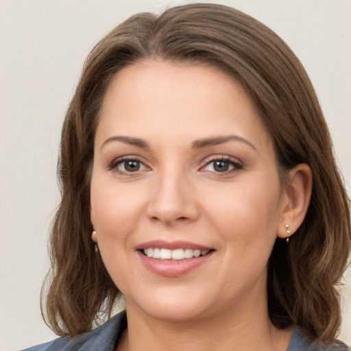 Joyful white young-adult female with medium  brown hair and brown eyes