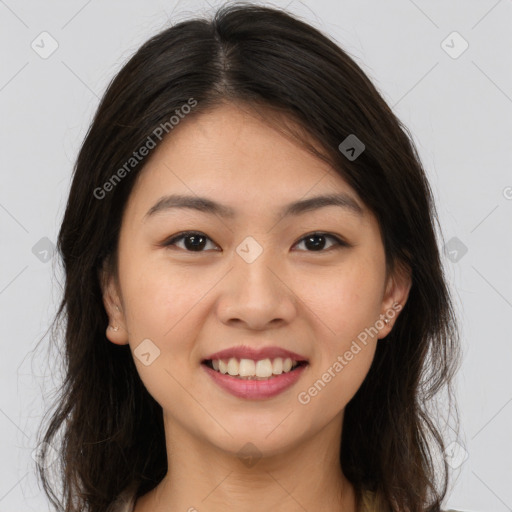 Joyful white young-adult female with long  brown hair and brown eyes