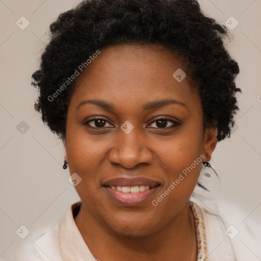 Joyful black adult female with short  brown hair and brown eyes