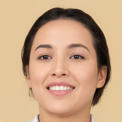 Joyful white young-adult female with medium  brown hair and brown eyes