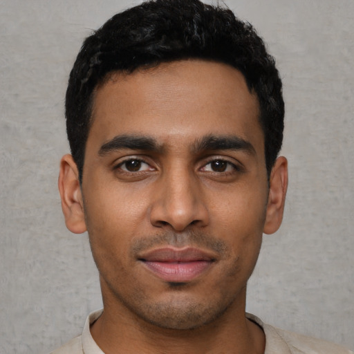 Neutral latino young-adult male with short  black hair and brown eyes