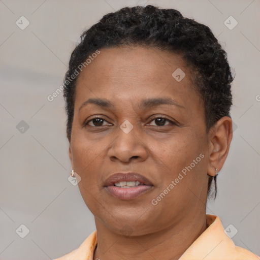 Joyful black adult female with short  brown hair and brown eyes