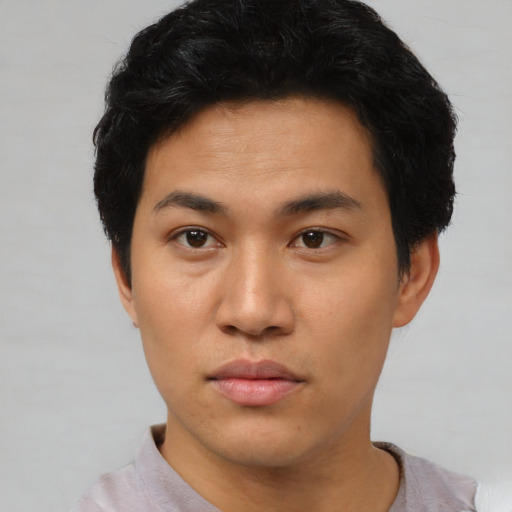 Neutral asian young-adult male with short  black hair and brown eyes