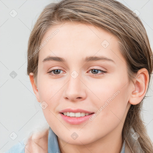 Joyful white young-adult female with long  brown hair and blue eyes