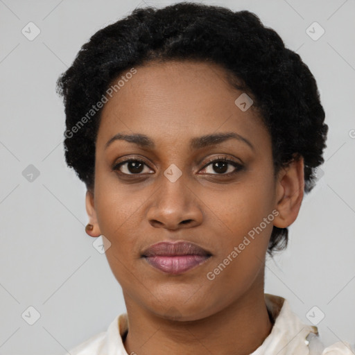 Joyful black young-adult female with short  black hair and brown eyes