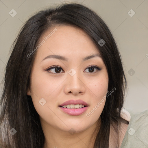 Joyful asian young-adult female with long  brown hair and brown eyes