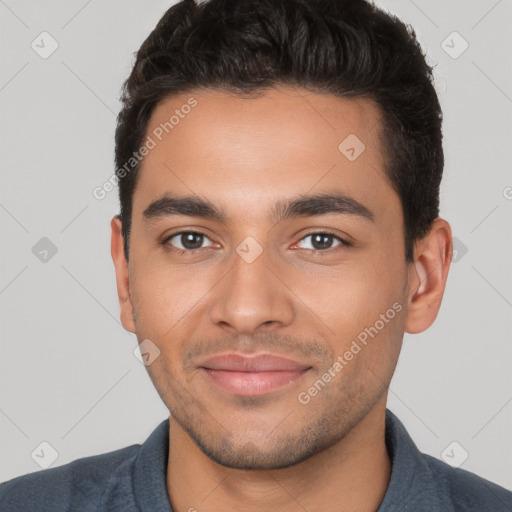 Joyful white young-adult male with short  black hair and brown eyes