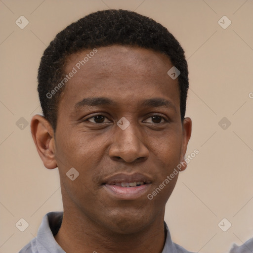 Joyful black young-adult male with short  brown hair and brown eyes