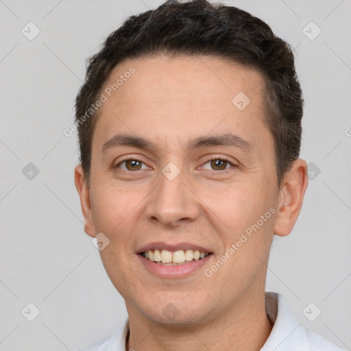 Joyful white adult male with short  brown hair and brown eyes