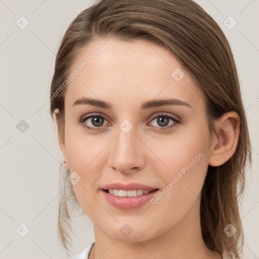 Joyful white young-adult female with medium  brown hair and grey eyes