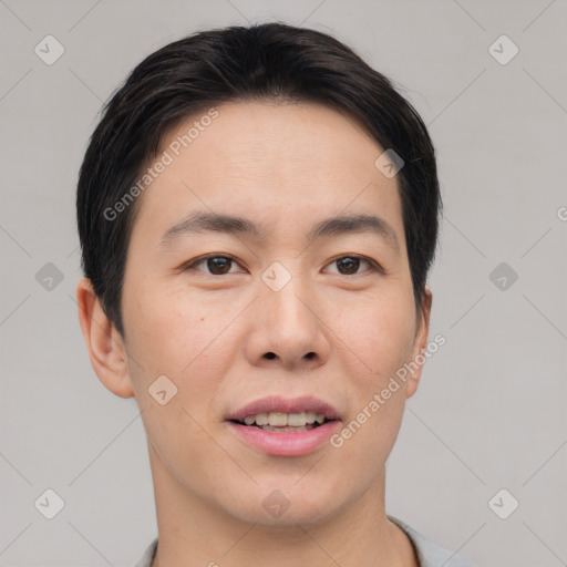 Joyful asian young-adult male with short  black hair and brown eyes