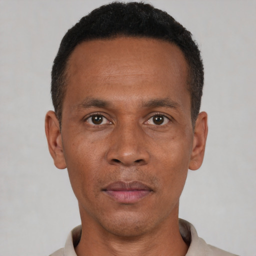 Neutral black adult male with short  black hair and brown eyes