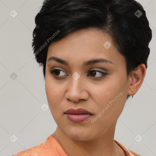 Joyful latino young-adult female with short  brown hair and brown eyes