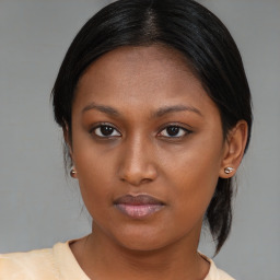 Neutral asian young-adult female with medium  brown hair and brown eyes