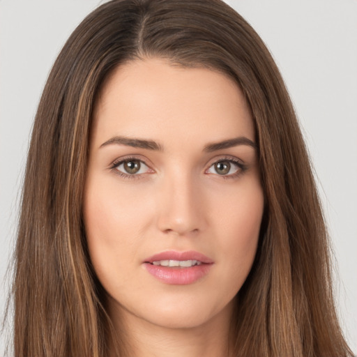 Neutral white young-adult female with long  brown hair and brown eyes