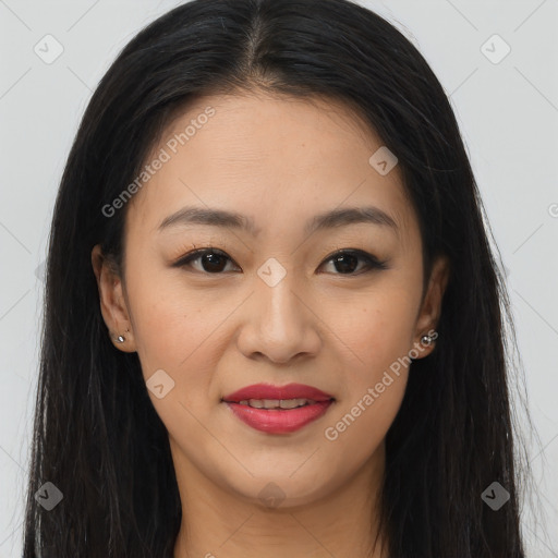 Joyful asian young-adult female with long  brown hair and brown eyes