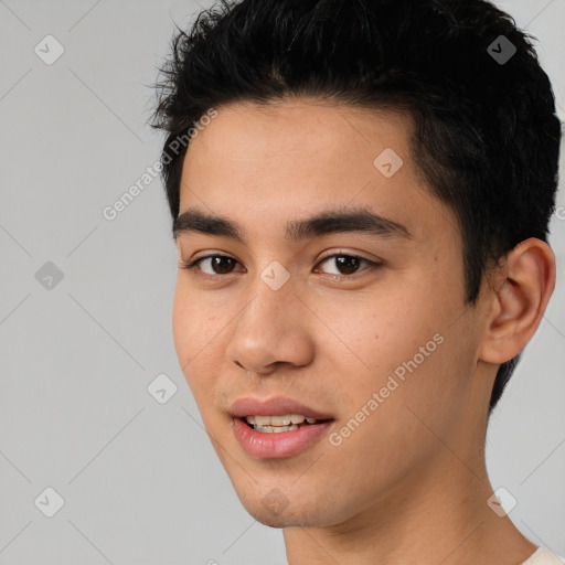 Joyful white young-adult male with short  black hair and brown eyes