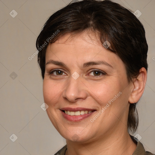 Joyful white adult female with medium  brown hair and brown eyes