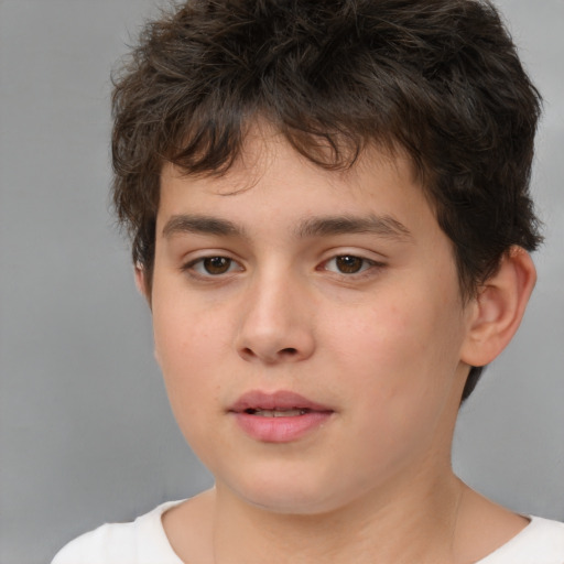 Joyful white child male with short  brown hair and brown eyes