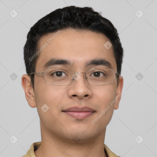 Joyful latino young-adult male with short  brown hair and brown eyes