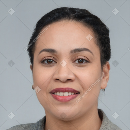 Joyful latino young-adult female with short  black hair and brown eyes