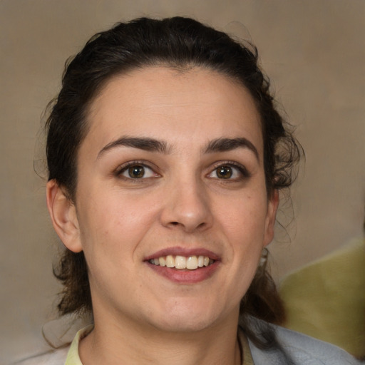 Joyful white young-adult female with medium  brown hair and brown eyes