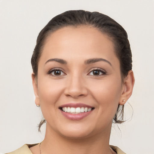 Joyful white young-adult female with medium  brown hair and brown eyes