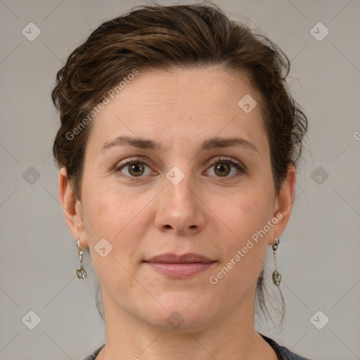 Joyful white adult female with short  brown hair and grey eyes