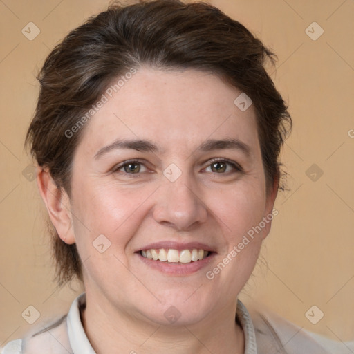 Joyful white adult female with short  brown hair and brown eyes