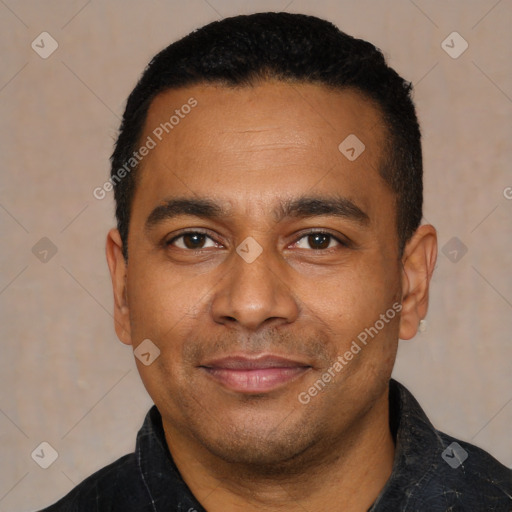 Joyful latino young-adult male with short  black hair and brown eyes