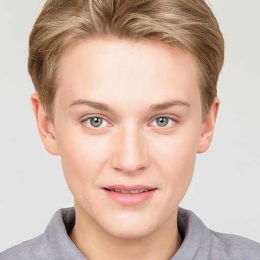 Joyful white young-adult female with short  brown hair and grey eyes