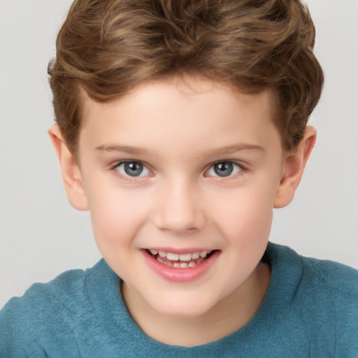 Joyful white child male with short  brown hair and brown eyes