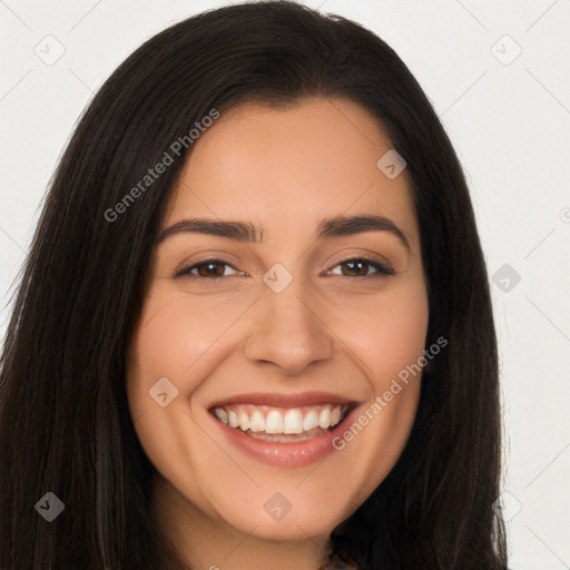 Joyful latino young-adult female with long  brown hair and brown eyes