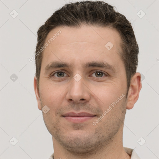 Joyful white adult male with short  brown hair and grey eyes