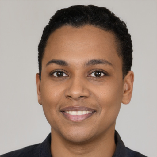 Joyful latino young-adult female with short  black hair and brown eyes
