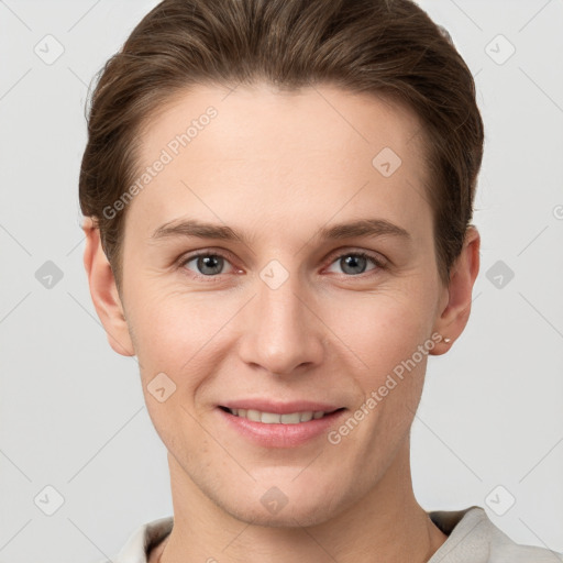 Joyful white young-adult female with short  brown hair and grey eyes