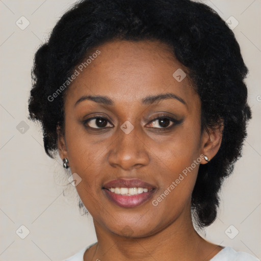 Joyful black young-adult female with medium  black hair and brown eyes