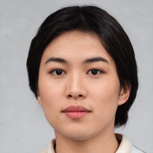 Neutral asian young-adult female with medium  black hair and brown eyes