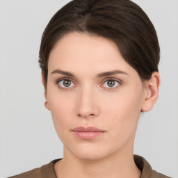 Neutral white young-adult female with short  brown hair and brown eyes